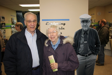 IMG_4167 2018-12-29 AHS all class holiday gathering Bob Buck and Anne (Knuths) Buck both #ahs1950 graduates with Farwell Brown poster at Ames History Center #AmesHighClassof1974 #AmesHighClassof1950